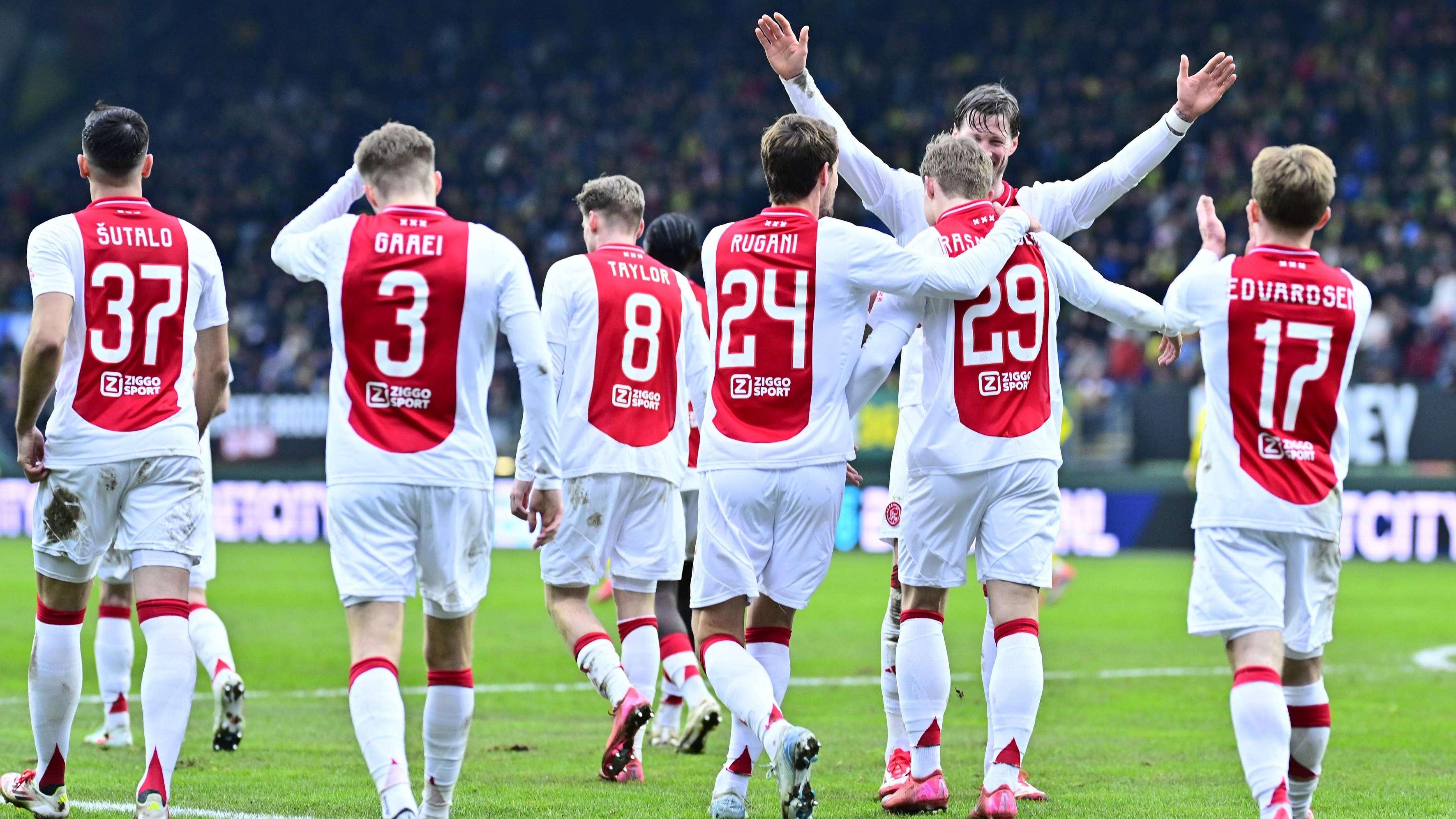 Christian Rasmussen (R) is celebrated for the 0-2 by Ajax player Daniele Rugani (24) and Wout Weghorst